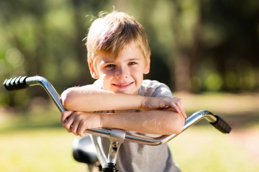 cute little boy on a bicycle